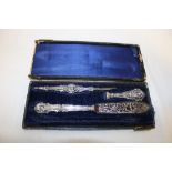 An old Continental part desk set with silvered handles decorated in relief with figureheads in part