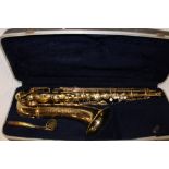 A brass Conn saxophone in fitted case