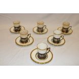 A set of six Edward VII Mintons china gilt edged coffee cups and saucers with silver pierced