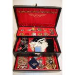 A jewellery box containing a large selection of various costume jewellery including silver dress