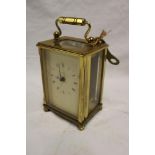 A good quality carriage clock with rectangular dial in brass traditional case