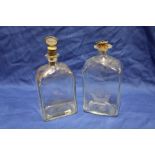 An old glass rectangular decanter with etched ship and castle decoration and one other gilt