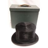 A gentleman's black Top Hat by Tress & Co London in fitted card case