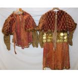 An unusual Eastern European costume comprising velvet lined jacket with fur edges and brass mounted