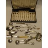 A set of six electroplated tea knives and forks in silk lined case together with a selection of