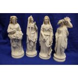 Four Parian-style figures of classical females on circular bases,