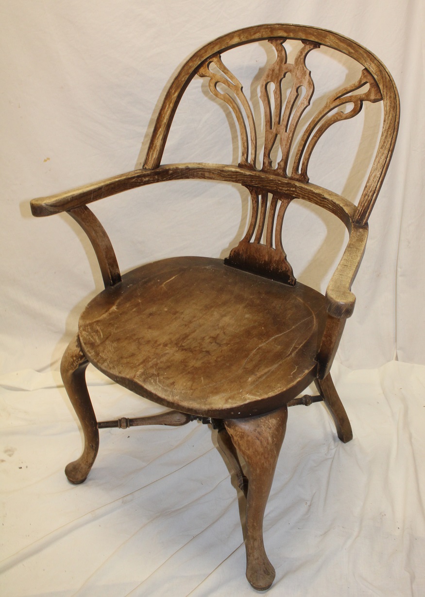 A beech and elm Windsor-style easy chair with pierced splat back and shaped seat on cabriole legs