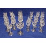 A good quality part suite of cut glass stemmed goblets with star cut decoration comprising 15 port