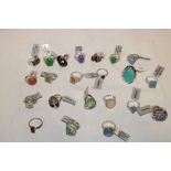 A selection of over 20 new silver dress rings set various gem stones