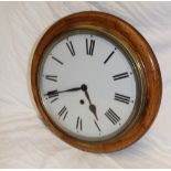 A good quality wall clock with 12" circular dial in oak circular case