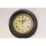 An old wall clock with circular dial marked for the Midland General Omnibus Co Ltd with later