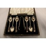 Six silver teaspoons with matching sugar tongs,