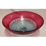 An art glass circular pedestal bowl with pink and blue striped decoration,