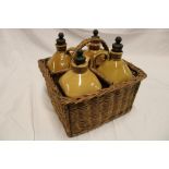 A set of four Victorian stoneware flagons impressed "Gin/Brandy/Irish Whisky" and one other,