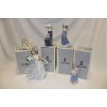 A collection of five Lladro china figures including large unboxed female figure and four various