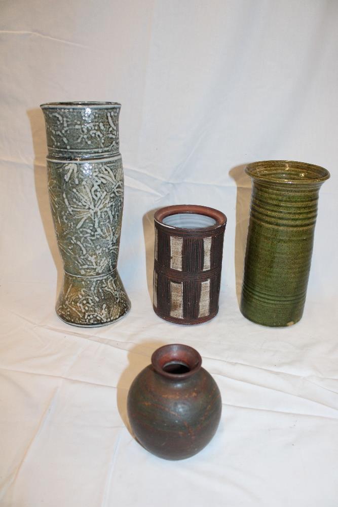 Four pieces of Studio pottery including oval pottery vase with leaf decoration etc.