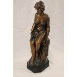 A 1930's bronzed plaster figure of a seated female, impressed "RD 778339 Made in London",