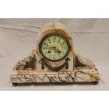 A good quality mantel clock with decorated circular dial in sienna marble arched case decorated in
