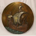 An unusual 1920/30s circular relief metal plaque depicting a sailing galleon at sea, signed "Takis",