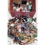 A box containing a large selection of mixed costume jewellery