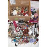 A box containing a large selection of various costume jewellery