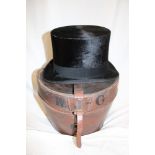 A gentleman's black top hat by Austin Reed Ltd in fitted leather case