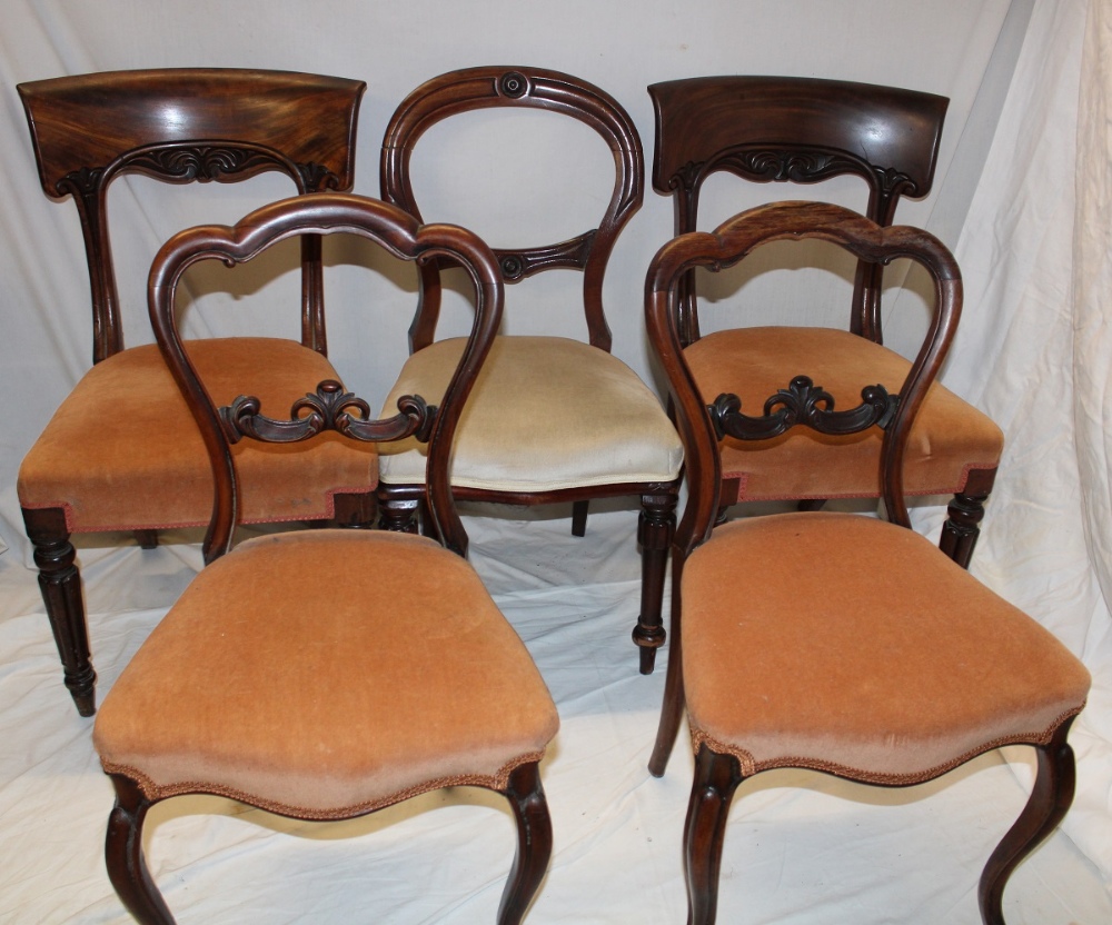 A pair of 19th century carved rosewood occasional chairs with rail backs and upholstered seats on