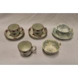 Three late 18th/early-19th century china tea cups with floral decoration and two matching saucers