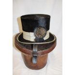 An unusual Portuguese black top hat with silver braid and rosette by A.