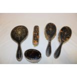 A good quality silver mounted tortoiseshell four-piece dressing set comprising a pair of hair