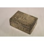An old silver Dutch-style rectangular table box decorated in relief with a river scene with