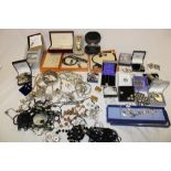 A selection of various costume jewellery including necklaces, brooches, earrings, wristwatches,