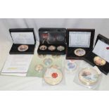 A selection of various commemorative coins and crowns including two large 100mm silver-plated