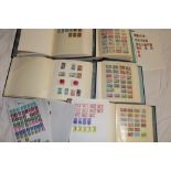 Six large albums containing a selection of World stamps