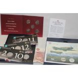 A Battle of Britain silver commemorative coin cover, Christmas Carol 50p coin collection,