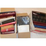 A large selection of various empty stamp albums, album pages, stamp mounts,