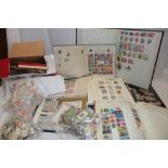 A box containing a large selection of various albums of mixed World stamps, packets of stamps etc.
