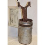 An aluminium and iron piston from a Spitfire aircraft with certificate of authenticity "Battle of
