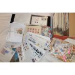 A box containing various packets of World stamps,