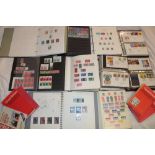 Nine albums and stock books containing a collection of GB stamps together with stamp catalogues