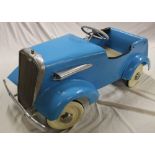 A 1940/50's Tri-ang painted metal pedal car based on an open sports car,