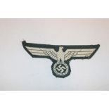 An original German Army Officer's embroidered cotton tunic eagle