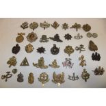 A selection of various military cap badges including bronze Queen's Own Dorset Yeomanry, Notts.