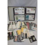 An album containing a collection of GB first day covers,