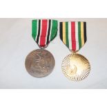A first Gulf War Bahrain Liberation of Kuwait medal and a United Arab Emerates 1991 Liberation of