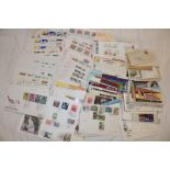 A box containing a selection of GB and World first day covers and postal covers