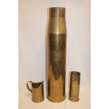 A large brass shell case 27½" high,