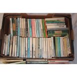 A box containing vintage crime and fiction paperback volumes
