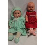 A German composition baby doll and one other composition doll (2)