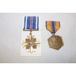 A USA Air Force and Space Force Commendation medal and a USA Distinguished Flying Cross (2)